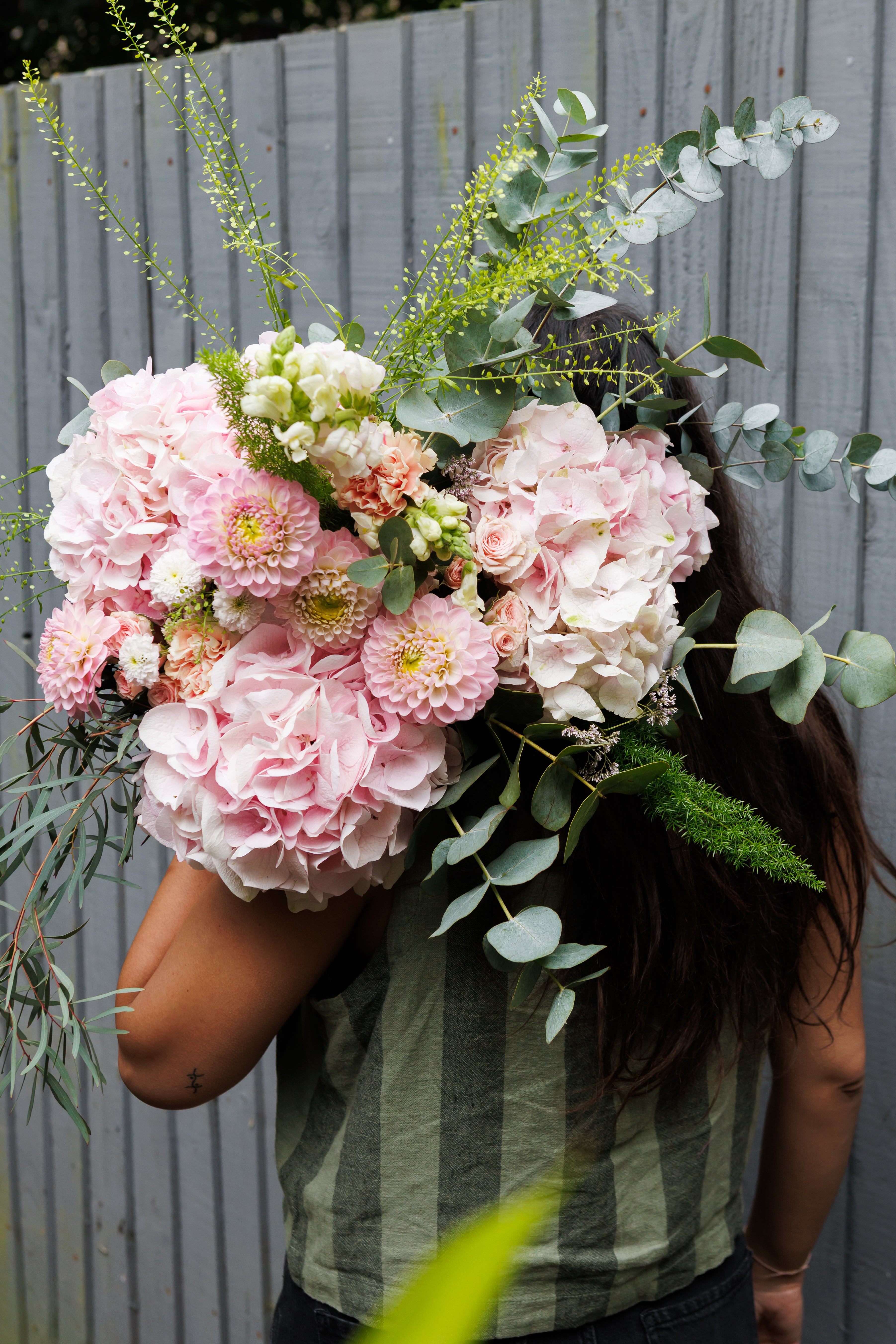 Hand-tied bouquet of pink dahlias, hydrangeas and roses by Brothers Green